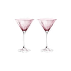 To facetslebne cocktailskåle i pink farvet krystalglas med riflet diamantmønster fra Frederik Bagger