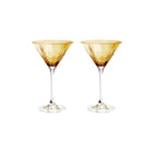 To facetslebne cocktailglas i citrinefarvet krystalglas med diamantmønster og klart stilk fra Frederik Bagger