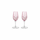 To facetslebne portvinsglas i rosa farvet krystalglas med diamantmønster fra Frederik Bagger toppet med klart glas