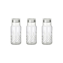 Tre klare facetslebne glasflasker med diamantmønster og låg til opbevaring fra Frederik Bagger