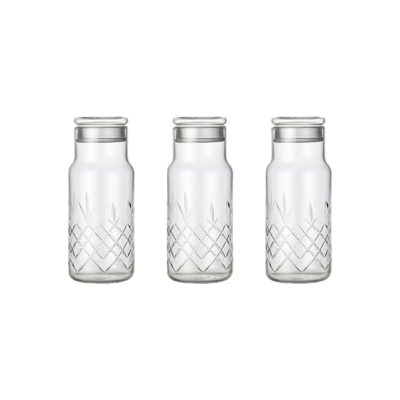 Tre klare facetslebne glasflasker med diamantmønster og låg til opbevaring fra Frederik Bagger