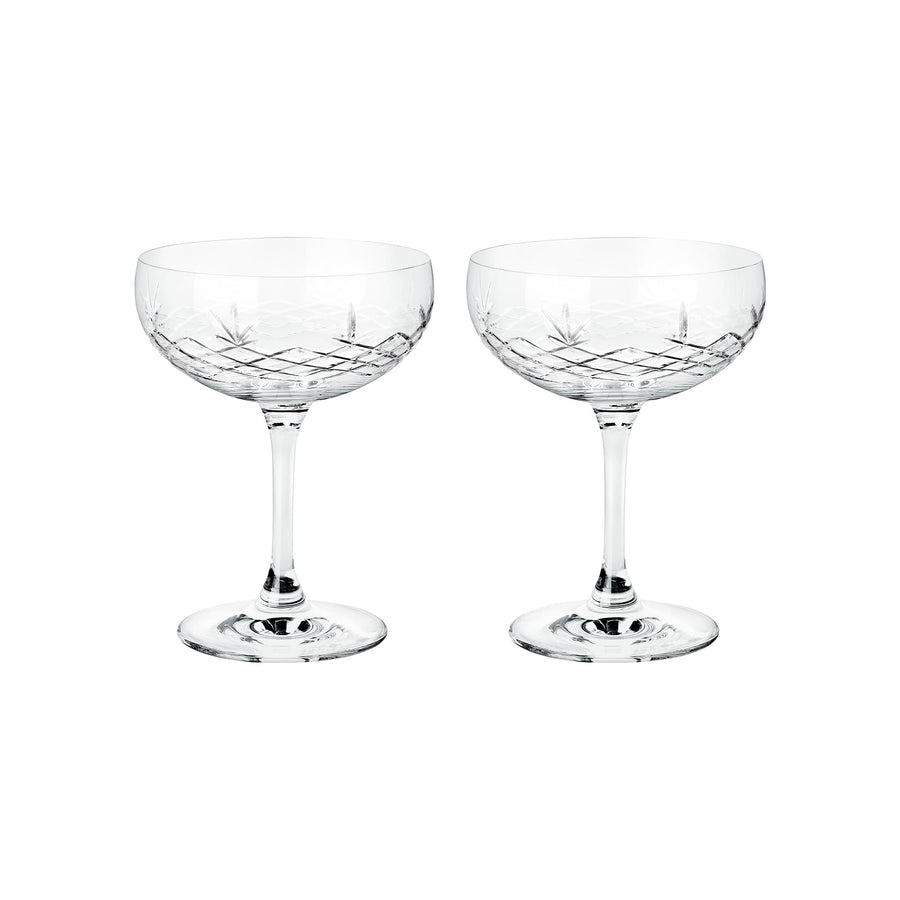 To facetslebne champagneskåle i klart krystalglas med diamantmønster til servering fra Frederik Bagger